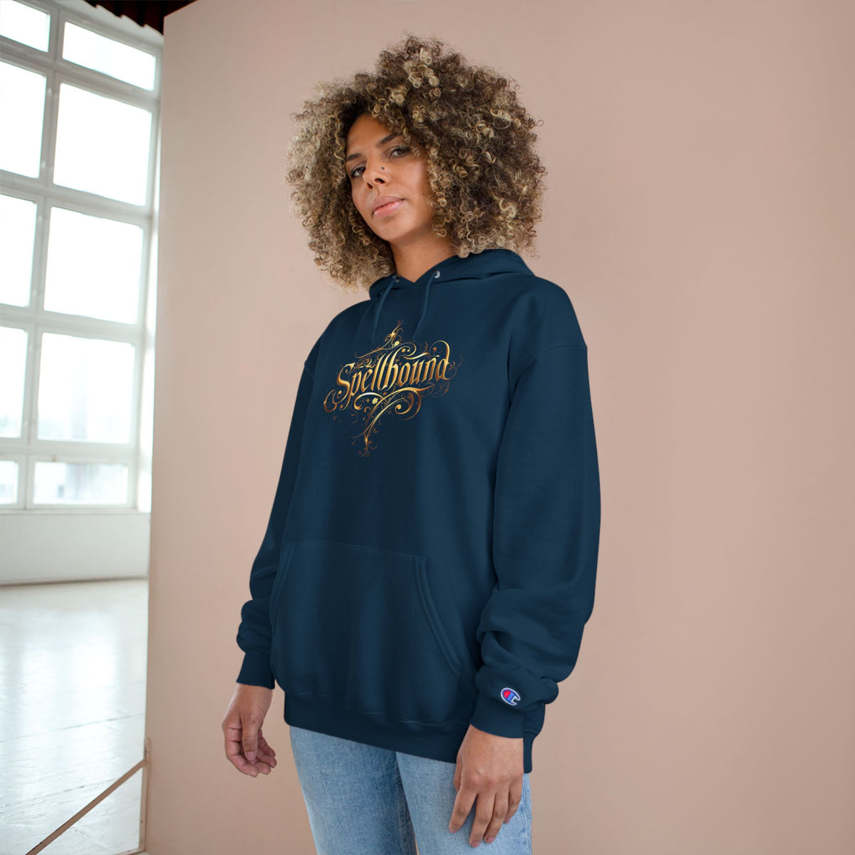 Spellbound Unisex Champion Hoodie – Fantasy Gold Lettering